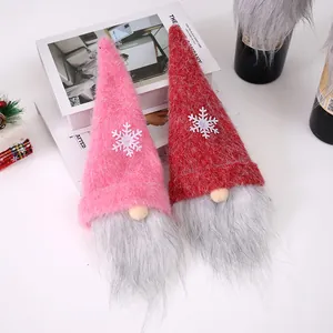 Pink and red Christmas gnome wine bottle covers with long beards and snowflake detail