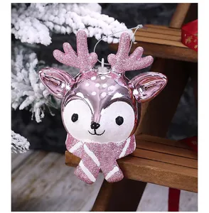 Detailed view of a cute pink glittery cartoon deer Christmas tree hanging ornament