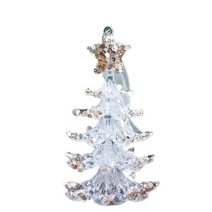 Sparkling acrylic Christmas tree hanging ornament with gold sequins and star topper.