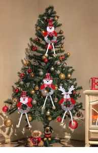 Set of festive Christmas tree ornaments featuring Santa, snowman, and reindeer with bells