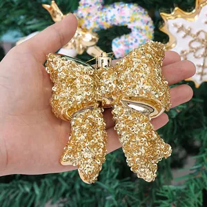 Glinsterende gouden pailletten strik als kerstboomversiering voor de feestdagen