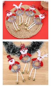 Close-up of Christmas ornaments featuring Santa, Snowman, and Reindeer with long bell legs.