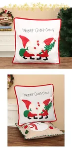 Close-up detail showing festive gnome embroidery on white and red Christmas pillowcases