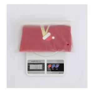 Weight display of a large red Christmas stocking in frosted plastic packaging, 101.1g