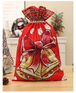 Detail of red velvet Christmas drawstring bag with bell and bow print