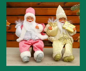 Detailed view of sitting 12-inch Santa Claus figurines in pink and gold velvet