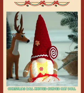 Glowing Christmas gnome doll with red knitted hat and festive gingerbread man detail