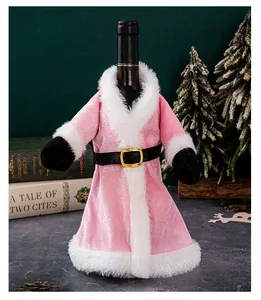 Festive pink velvet Christmas wine bottle cover with white fur trim and gold buckle belt