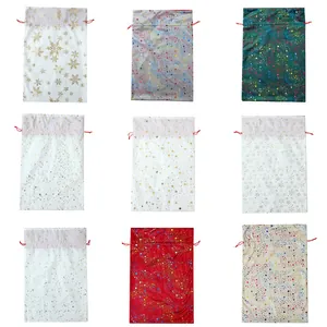 Assorted Christmas gift bag set with gold foil stars and snowflakes patterns and red drawstrings