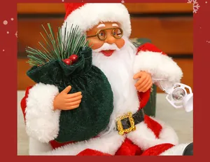 Close-up of 12-inch sitting Santa Claus doll with green gift bag and lantern