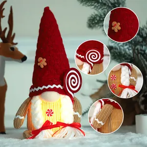 Illuminated Christmas gingerbread gnome plush decoration with red hat and candy cane
