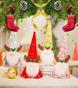 Group of four decorative sequined Christmas gnomes with reindeer antlers and long white beards