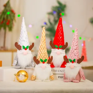 Set of four plush Christmas gnomes with sequined reindeer antler hats for holiday decor