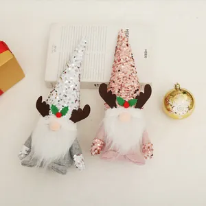 Festive pair of Christmas gnomes featuring sequin reindeer hats and white plush beards