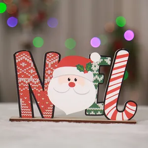 Decorative wooden Noel sign with Santa Claus face for festive Christmas desktop display