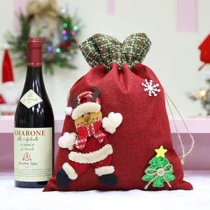 Festive red burlap Christmas gift bag with reindeer applique and drawstring closure