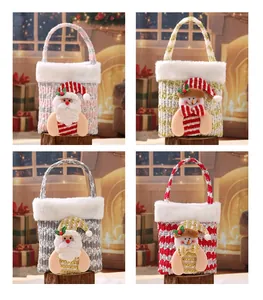 Variety of plush Christmas gift bags featuring festive Santa and Snowman character designs.