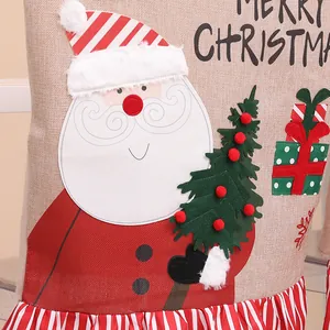 Festive burlap Christmas chair cover featuring a cartoon Santa Claus and gift box