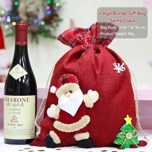 Large red burlap Christmas drawstring gift bag featuring a cute 3D Santa Claus design