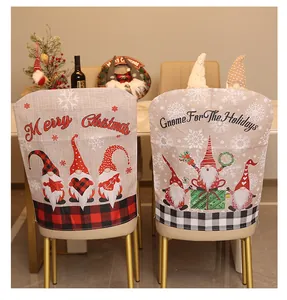 Detailed view of Christmas gnome chair covers with festive patterns and plaid trim