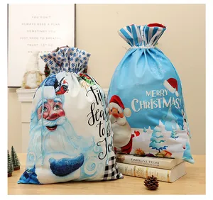 Detailed view of two velvet Christmas drawstring gift bags with Santa Claus prints