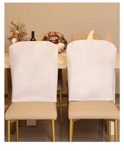 Back view of minimalist white Christmas chair covers in a festive dining room setting