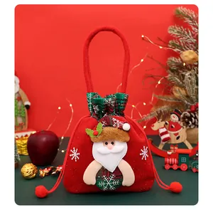 Detail view of red felt Christmas gift bag featuring a cute Santa Claus applique