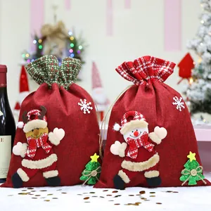 Festive large red Christmas linen drawstring gift bags with snowman and reindeer