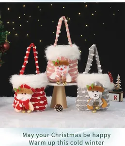 Three plush Christmas gift bags with festive character decorations and bells