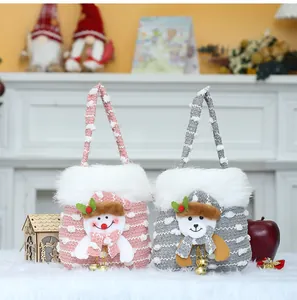 Set of festive knitted Christmas gift bags with snowman and bear 3D decorations