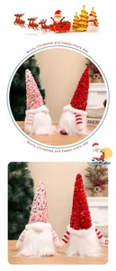 Close-up of two sequined Christmas gnome dolls with festive holiday scene background
