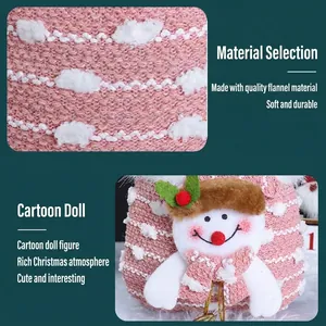 Pink knitted Christmas gift bag featuring a soft plush snowman doll with holly detail