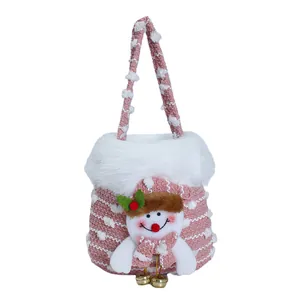 Decorative pink knitted Christmas gift bag featuring a cute plush snowman design