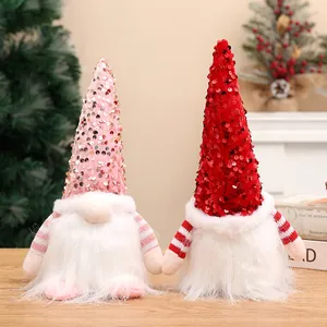 Pair of festive Christmas gnomes with shiny sequined hats and plush white beards