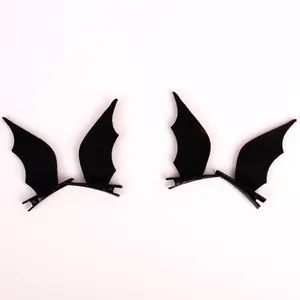 Close-up view of black felt bat wings hair clips for Halloween devil cosplay accessories