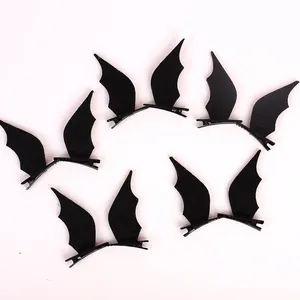 Detail view of multiple black bat wing hair clips with alligator clips for Halloween costume