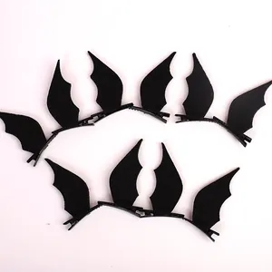 Detail view of black bat wing hair clips for Halloween costume hair accessories.