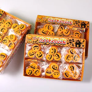 Detailed view of multiple boxes of Halloween pumpkin erasers with cute carved expressions