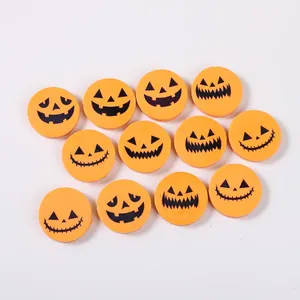 Detailed view of Halloween pumpkin face erasers for festive stationary gifts