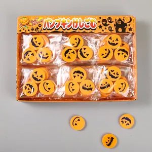 Close-up of Halloween pumpkin erasers set featuring various faces in a retail display box