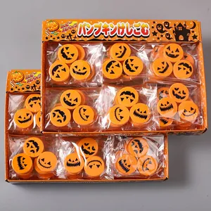 Assorted Halloween pumpkin erasers with emoji faces shown in retail display box