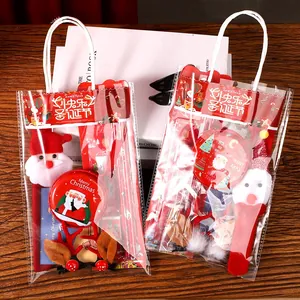 Set de regalo de papelería navideña en bolsas transparentes con Papá Noel