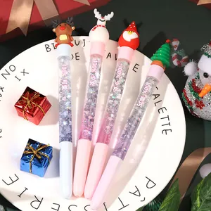 Christmas liquid glitter gel pens with cute cartoon toppers on a white plate