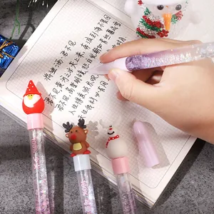 Festive Christmas liquid quicksand gel pen featuring cute Santa and reindeer toppers