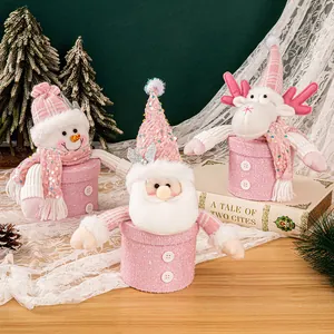 Pink Christmas plush gift boxes featuring Santa Claus, Snowman and Reindeer characters