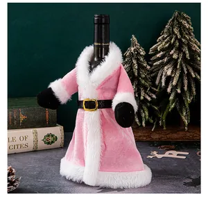 Close-up of pink velvet Santa wine bottle cover with white fur trim and belt