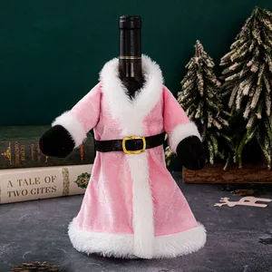 Pink velvet Santa dress wine bottle cover for festive Christmas table decorations.