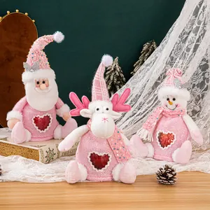 Set of pink plush Christmas gift bags with heart windows featuring Santa, reindeer, and snowman