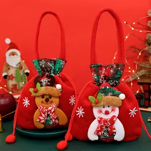 Red Christmas gift bags with plush reindeer and snowman dolls for festive candy treats