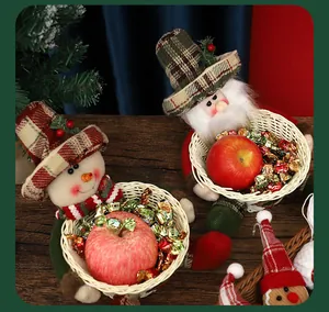 Festive close-up of Christmas gnome and snowman plush candy baskets on a wooden table